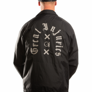 man with black great injuries coach jacket drip