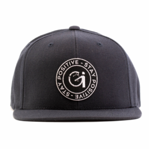 navy blue snapback hat with black and white patch