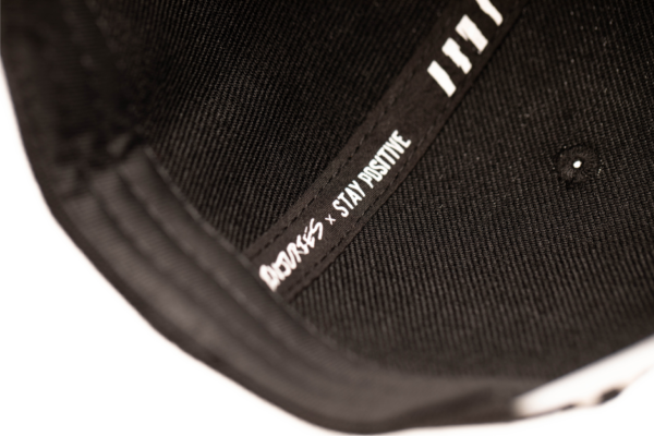 inner liner of great injuries snapback with the text stay positive