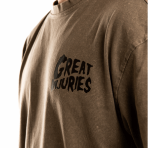 detail of chest logo from khaki shirt with black text