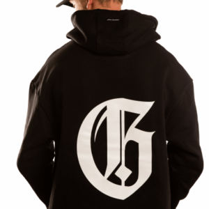 man with black hoodie and a big white g on the back