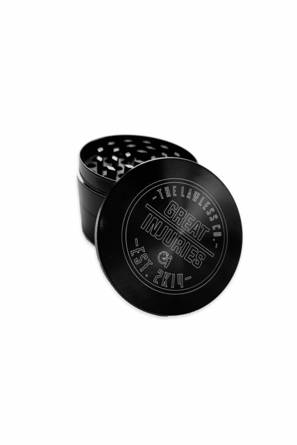 weed grinder with logo on cap in color black