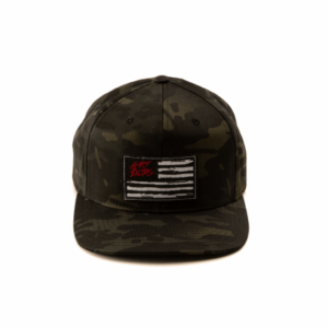 front of a camo snapback cap with flag on front