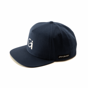 blue snapback hat with white logo and patch on side