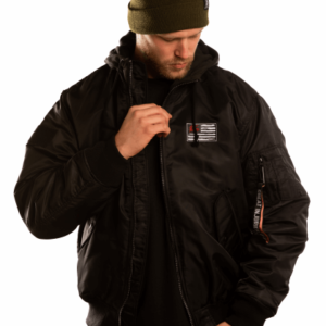 man with black bomberjacket with hood and patch on chest